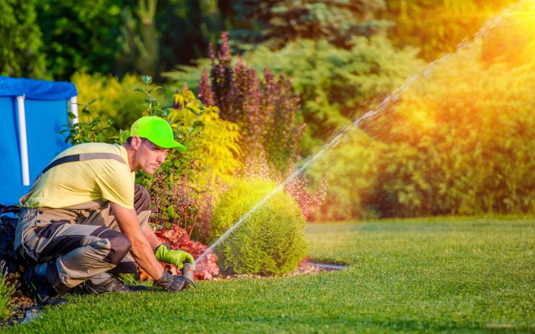 Home sprinkler system watering a lawn in Utah as part of a professional installation by CV Lawn King.